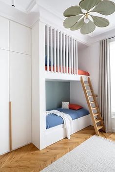 there is a bunk bed with a ladder in the room