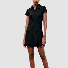 Fitted Polo Dress, designed to blend timeless style into your look. This dress features a classic polo collar and zip-up front and two front pockets design, offering a polished yet chic look. Crafted from a soft, stretchy fabric, providing a flattering silhouette that’s perfect for any occasion. The short sleeves and knee-length hemline make it versatile enough for both casual outings and dressier events. Elevate your wardrobe with this must-have piece that seamlessly transitions from day to nig Pockets Design, Black Polo, Chic Look, Dress Zipper, Polo Dress, Polo Collar, Stretchy Fabric, Short Dress, Dresses Xs