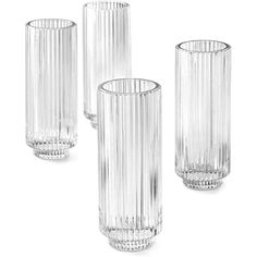 three clear glass vases sitting next to each other