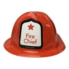 a red hard hat with a fire chief sticker on it's front side