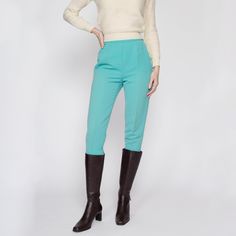 Vintage 60s/70s women's aqua blue high waisted ski pants with stirrups, with a petite fit. Closes with a metal side zipper and two hooks at the waist. Measurements and Condition:    Fits like: Women's petite extra small - see inseam measurement to ensure fit, they were too short to actually be worn with the stirrups on the model. Fabric: Unknown, medium-weight, perhaps a wool blend Brand: Unknown, made in Austria Condition: Very good, with light general wear, some very faint discoloration to the Vintage Stirrup Pants, Vintage Trousers For Winter, Vintage Winter Trousers, Vintage High Waist Winter Pants, Retro Style Winter Workwear Pants, Retro Winter Trousers, Vintage Tapered Leg Winter Pants, Vintage Full Length Bottoms For Winter, Light Blue Fitted Full-length Bottoms