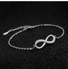 ♥ MATERIAL: 925 sterling silver and cubic zirconia. 925 Sterling Silver is the ideal metal material for making accessories thanks to its proven shine, brightness and strength. ♥ size: bracelet length: 15cm + 4cm (extension), infinity size: 2*1cm, weight: 1.8g. ♥ Infinity Design: Infinity symbol silver bracelet, simple and elegant design. Infinity means infinite love and friendship forever. It is an ideal gift for your good friend, lover or yourself. ♥ Packaging: Packed in a filigree gift box, it Minimalist Cubic Zirconia Bracelets For Party, Elegant Sterling Silver Diamond Bracelet For Party, Elegant Diamond Bracelet With Silver Chain In White Gold, Crystal Diamond Bracelet As Gift, Elegant Silver Crystal Bracelets, Elegant Diamond Bracelet With Silver Chain, Elegant Sterling Silver Chain Bracelet For Party, Sterling Silver Jubilee Bracelet For Party, Elegant Infinity Bracelets With Diamond Accents