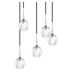 three lights hanging from a ceiling fixture with clear glass shades and black metal rods,