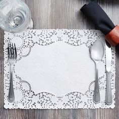 an empty place mat with silverware on it