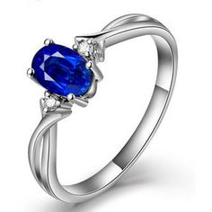 a blue sapphire ring with diamonds on the sides