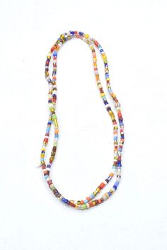 "This is a Wonderful Vintage African Bright Christmas Glass Bead Strand. Also called Christmas beads these multicolored 3-4mm glass beads are actually vintage Czech glass made to be sent to Africa. Christmas beads comprise of a special blend of choice beads created in former Czechoslovakia for use in Africa. Also known as \"African love beads,\" each strand is unique; no two strands are alike. A wonderful necklace to wear or cut up and use in all your creative jewelry designs. If wearing as a ne African Christmas, Christmas Beads, African Love, Seashell Jewelry, Christmas Bead, Bright Christmas, Bone Beads, Cut Up, Shell Crafts