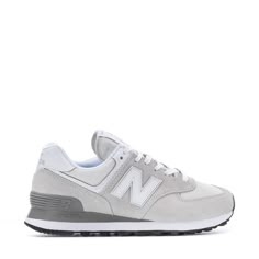 Add retro flair to your wardrobe with the women's New Balance 574 sneaker. Iconically original, this classic women's wide sneaker is famous for its comfortable cushioning and timeless leather design. Elevate your everyday style with a 574 or take your business casual to the next level with this premium classic. Features: Durable upper made with premium materials. ENCAP® midsole technology provides support. EVA foam midsole and heel add cushioning. Custom tread rippled rubber outsole with toe-tip Cute Womens Shoes For School, New Balance 574 Womens, Nb Shoes, Nimbus Cloud, New Balance Classics, Wide Sneakers, Zapatillas New Balance, Grey New Balance, Shoes For School