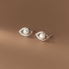 s925 sterling silver pearl studs retro earrings Precious Gift for Christmas, Birthday, Graduation, Wedding, Bridal Shower, Baptism, Anniversary, Party, and First Communion. Eternal Memories: Express love to your girlfriend, partner, wife, daughter, mother, bride, and new mother. Exquisite Craftsmanship:  handmade Free Shipping: Royal Mail or Yodel Fast Delivery within the UK Complimentary Box: Free packaging box Quality Materials: 925 Sterling Silver Our products meet high standards, crafted by skilled artisans using hypoallergenic 925 sterling silver. Perfect for everyday wear. * Elegant Packaging The necklace comes in a beautifully crafted gift box, ensuring satisfaction with our packaging! Optionally, I can include a personalized gift message. * Easy Returns We gladly accept returns or Dainty Silver Pearl Earrings For Gift, Dainty Silver Pearl Earrings For Formal Events, Silver Dainty Pearl Earrings For Formal Occasions, Dainty Silver Pearl Earrings For Formal Occasions, Sterling Silver Pearl White Earrings For Anniversary, Anniversary White Pearl Earrings In Sterling Silver, Classic Silver Pearl Earrings For Gift, Silver Dainty Pearl Earrings With Cubic Zirconia, Silver Cubic Zirconia Dainty Pearl Earrings