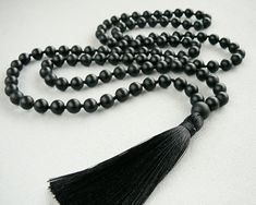 Black Mala Necklace 108 Mala Bead Necklace for Man Women Gift Matte Black Onyx Mala Beaded Necklace Hand Knotted Black Tassel Long Necklace - 8mm Matte Black Onyx 108 beads - 10 mm Black Onyx Guru bead - 9cm Black tassel MY SHOP: https://www.etsy.com/shop/BonBonStones Please contact me with any questions. I'm happy to help! Elegant Beaded Necklaces For Meditation, Elegant Beaded Necklace For Meditation, Black Hand-strung Beads As Gift, Black Hand-strung Beads Gift, Spiritual Black Jewelry For Party, Gift Hand-strung Black Beads, Black Spiritual Jewelry For Party, Elegant Black Jewelry With 108 Beads, Adjustable Black Beaded Necklace With Gemstone Beads