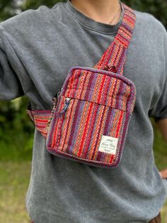 - Elevate your style with our handcrafted Pure Hemp Rasta Crossbody Bag - Versatile design doubles as a chest or waist belt for both men and women - Crafted from pure hemp, handwoven by skilled artisans in Nepal's mountain region - Vibrant Rasta colors add a bold and expressive flair to your ensemble - Features a small zip pocket in the front and a spacious main zip pocket - Keeps your essentials secure while on the go - Embrace conscious consumerism and support local communities and the environ Daily Use Chest Bag With Zipper Pouch, Red Pouch Belt Bag For Daily Use, Multicolor Belt Bag With Adjustable Strap, Multicolor Shoulder Belt Bag With Adjustable Strap, Multicolor Belt Bag For Daily Use, Red Rectangular Belt Bag For Everyday Use, Rectangular Red Belt Bag For Everyday Use, Multicolor Rectangular Belt Bag For Everyday Use, Casual Rectangular Belt Bag As Gift