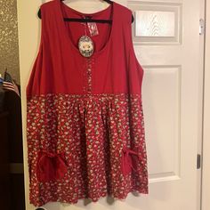 a red dress hanging up on a door