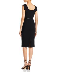 Find BLACK HALO Jackie Sheath Dress on Editorialist. The Black Halo Jackie Sheath Dress features a body-skimming fit at the bust and hips, a fitted waist with a cinched belt, and a knee-length hem. It has a back zipper and a stretchy fabric. The dress measures approximately 40 inches from the back of the neck to the hem, based on a size 2. Sleek Fitted Sheath Dress, Sleek Fitted Sheath Midi Dress, Fitted Sleek Sheath Midi Dress, Black Fitted Midi Dress With Straight Neckline, Black Midi Dress With Straight Neckline For Work, Black Sheath Midi Dress With Fitted Bodice, Elegant Black Bodycon Dress With Straight Neckline, Black Halo, Black Sheath Dress