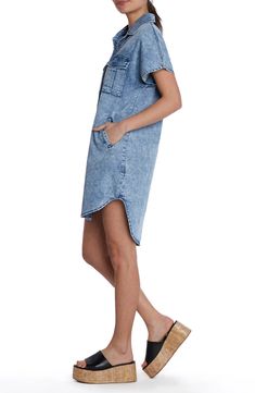 This season-staple denim dress is designed with abbreviated sleeves and a curved high-low hem. Front button closure Spread collar Short sleeves Chest button-flap patch pockets; side pockets 62% lyocell, 20% cotton, 12% polyester, 5% rayon, 1% spandex Machine wash, tumble dry Imported Summer Denim Washed Shirt Dress, Casual High-low Hem Shirt Dress For Spring, Casual Denim Knee-length Shirt Dress, Casual Summer Shirt Dress With High-low Hem, Casual High-low Hem Shirt Dress For Summer, Short Sleeve Denim Shirt Dress For Daywear, Spring Casual Shirt Dress With Curved Hem, Casual Spring Shirt Dress With Curved Hem, Casual Shirt Dress With Curved Hem For Spring