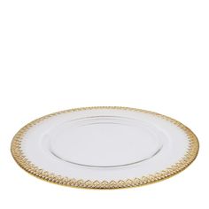 an empty white plate with gold trim