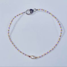 Handmade By Me One Size Fits Most Dainty Choker Necklace Natural Freshwater Pearl In Center Pink,Purple,Yellow Seed Beads In Pattern Silver Lobster Clasp Easy To Put On Goes With Everything & Simple Trendy Necklace Summer Purple Beaded Necklaces With Colorful Beads, Summer Purple Beaded Necklace With Colorful Beads, Purple Beaded Bracelets With Colorful Beads For Summer, Colorful Beaded Purple Bracelets For Summer, Purple Colorful Beaded Bracelets For Summer, Tan Stone, Gold Chain Link Necklace, Purple Bead Necklace, Dainty Choker Necklace