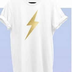 Bella Canvas Tshirt. White With Gold Lightening Bolt. Trendy Gold Summer T-shirt, Trendy Gold T-shirt For Summer, Casual Gold T-shirt For Summer, Gold Graphic Tee With Crew Neck, Gold Casual T-shirt With Screen Print, Casual Gold T-shirt With Screen Print, Spring Gold Graphic Print T-shirt, Trendy Gold Cotton T-shirt, Gold Graphic Tee Tops For Summer