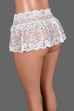 *Free USA shipping! *Handmade after you order: check order processing times This low-rise mini skirt is made out of sheer ruffled white stretch lace. ♦LENGTH: about 9 inches. All sizes are the same length. ♦FABRIC TYPE: Nylon/spandex lace ♦FEATURES: Both hem and waistband have scalloped edge ♦WASHING INSTRUCTIONS: hand wash cold or machine wash cold in a mesh garment bag, hang dry ■SIZE INFO: Find the size chart in the item images. Choose your size based on your waist measurement. This skirt is made out of stretch fabric with an elastic waist and the waistband is sized a little bigger than our other skirts so you can wear it lower around your waist. Size chart shows body measurements, not skirt measurements. The actual skirt waistband will be slightly smaller than your waist and stretch to Fitted Scalloped Lace Skirt, Stretch Lace Mini Skirt With Lace Trim, Flirty Lace Skirt With Lace Trim, Flirty Lace Trim Skirt, White Ruffled Skort For Party, Lace Ruffled Fitted Mini Skirt, Fitted Lace Mini Skirt With Ruffles, Elegant Lace Mini Skirt With Ruffles, White Fitted Lace Mini Skirt