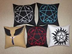 four pillows with different designs on them