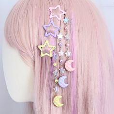 Dreamy moon magic! Shimmering moon and star themed hair clips; use them to keep stray hairs in place or just to infuse your hair with a touch of kawaii. Check out the matching necklaces here: https://www.etsy.com/uk/listing/1745777309/fairy-kei-necklaces-kawaii-moon-and-star Measurements: Overall clip length (approx.):  5.1" / 13cm Star clip size (approx.): W 1.2" x 1.2" / W 3cm x H 3cm Moon pendant size (approx.): W 0.8" x 0.8"  / W 2cm x H 2cm Small parts may pose a choking hazard. This item is not a toy. Candy Hair Accessories, Pastel Decora Fashion, Decora Hair Clips, Pastel Kidcore Outfits, Kawaii Clips, Yume Kawaii Fashion, Decora Hair, Decora Kei Fashion, Fairy Kei Accessories