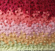 there is a crocheted blanket with flowers on it