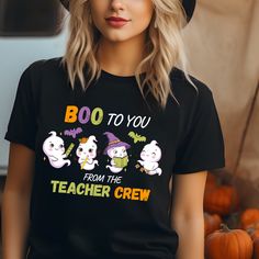 The students will surly love this cute Halloween Ghost shirt. This T-shirt is also a great teacher gift. Thank you for supporting my small business. This classic unisex jersey short sleeve tee fits like a well-loved favorite. Soft cotton and quality print make users fall in love with it over and over again. These t-shirts have-ribbed knit collars to bolster shaping. The shoulders have taping for better fit over time. Dual side seams hold the garment's shape for longer.  .: 100% Airlume combed and ringspun cotton (fiber content may vary for different colors) .: Light fabric (4.2 oz/yd² (142 g/m .: Retail fit .: Tear away label .: Runs true to size Black T-shirt With Funny Text For School, Black T-shirt With Funny Text For School Spirit, Black School Spirit T-shirt With Funny Text, Fun Black T-shirt For School, Funny Black T-shirt For School, Black Fall School T-shirt, Black T-shirt With Funny Print For School, Black T-shirt For School In Fall, Black Top With Custom Print For Teacher Appreciation