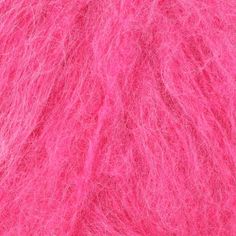 bright pink yarn is shown in this close up photo, with the top layer visible