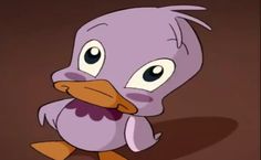 a purple bird with big eyes and an orange beak