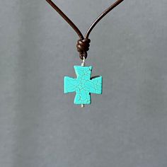 "✦This leather necklace has a large turquoise greek equal-armed cross pendant made of howlite, also called magnesite. The pendant is looped through a leather cord.  The pendant measures 1 inch in diameter, 1/4 inch thick, and is hung on a smooth greek leather cord with a diameter of approximately 2mm.  Closes with a sturdy sterling silver lobster clasp and end cap loop.  The necklace comes in your choice of black or brown leather, in lengths of 16, 18, 20, 22, 24 or 26 inches or custom length.   ✦To measure your neck size, take a piece of string and wrap around to the length you desire, then measure the length of the string.   Please select the necklace length and color at check out. ✦Click here to see the matching turquoise cross earrings: https://www.etsy.com/listing/1218478201 ✦Your jew Leather Necklace Diy, Necklace Leather Cord, Turquoise Cross Necklace, Tiny Pendant, Leather Cord Necklace, Diy Jewelry Projects, Necklace Leather, Turquoise Cross, Leather Corded Necklace