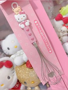 hello kitty kitchen utensils are in a pink box