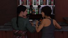 two women standing at a bar talking to each other