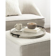 a coffee table with a bowl of cereal on it and a book in the middle