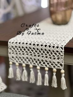 crocheted table runner with tassels and beads