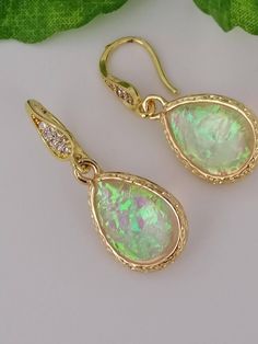 Details *Handmade items *Dispatches from a small business in Australia *Materials: Imitation opal, Gold plated fittings *Location: Earlobe *Closure: Ear wire Description These are pair of beautiful opal drop Earrings. These unique opal (created opal) earrings are so simple & beautiful, and go perfectly with any outfit! Introducing these opal teardrops size 13 × 18 mm, full length of the earrings is 33 mm. All metallic elements are 18k Gold Filled.  Gorgeous, Colorful Opal Earrings can be perfect Opal Drop Earrings, Unique Opal, Handmade Jewelry Gift, Opal Earrings, Drop Earring, Gold Plated Earrings, Opal Jewelry, Jewelry Handmade, Ear Wire