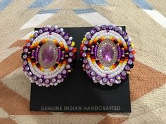 Authentic Beautiful Navajo Handcrafted Pow Wow Fancy Dancer Hand Beaded Earrings with Leather Backing. Embellished with Swarovski Crystals. Handcrafted by Navajo Artist R. Sellers Perfect for a Gift❤️ Powwow Earrings, Traditional Purple Beaded Earrings For Festivals, Beaded Earrings Native 1stdibs, Native Anerican Earrings, Native American Beadwork Earrings Moon & Milk, Beaded Powwow Sets, Native American Wedding, Beautiful Beaded Earring, Bridal Accessories Jewelry