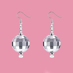 Quality-Made Retro Disco Ball Earrings / Solid Piece Disco Ball Earrings / Cute 70s 80s Disco Earrings Accessory You will look so cool rocking these retro disco ball earrings. The super bright light bounces off of your ears to create an awesome effect. Perfect for parties, concerts, festivals and more! We want your disco ball earrings to make you feel like a princess and this pair will do just that! Vintage style, quality jewelry to wear more than once at parties, clubs, or for everyday enjoymen Disco Style Silver Jewelry For Party, Retro Metal Earrings For Party, Retro Metal Party Earrings, Retro Jewelry For Pierced Ears For Parties, Retro Dangle Jewelry For Party, Metal Round Plug Earrings For Party, Retro Silver Jewelry For Party, Silver Retro Jewelry For Party, Round Metal Plug Earrings For Party