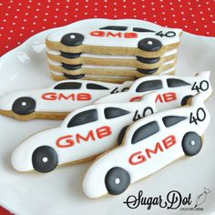 cookies decorated to look like police cars on a plate