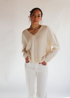 Anine Bing Lee Sweater | Tula Online Boutique Oversized Neutral V-neck Sweater, Cream Cashmere V-neck Sweater, Cream Oversized V-neck Sweater, Chic Neutral V-neck Sweater, Chic Beige V-neck Sweater For Layering, Beige V-neck Cashmere Top, Beige Cashmere V-neck Top, Oversized Fine Knit V-neck Sweater, Elegant Oversized V-neck Sweater