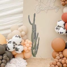 a birthday card surrounded by balloons and cacti