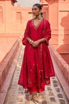 Red kurta with patra embroidery in floral pattern. Paired with a pant with patra embroidered hem and dupatta.
Components: 3
Pattern: Embroidery
Type Of Work: Patra, Floral
Neckline: V Neck
Sleeve Type: Three Quarter Sleeves
Fabric: Silk, Organza Silk
Color: Red
Other Details: 
Floral embroidered border dupatta
Note: The outfit worn by the model at the back is not for sale
Occasion: Mehendi and Haldi - Aza Fashions Red Anarkali, Easy Clothing, Blouse Yoke, Chanderi Dupatta, Red Kurta, Printed Embroidery, Chanderi Kurta, Cotton Dupatta, Hand Work Embroidery