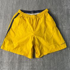 Vintage 2000s Nike Swoosh Check Two Pocket Sportswear Athletic Y2K Aesthetic Yellow Track Shorts Medium Mens Condition:  Excellent Used Condition  = No Flaws Measurements: Please see photos above for all measurements IF YOU BUY TWO OR MORE ITEMS USE THE CODE BUNDLE @ CHECK TO SAVE 20% WE SHIP WITHIN 24 HOURS AFTER PURCHASE! Please be aware that we do not offer free returns!! The Buyer is responsible for the cost of the return label. Follow us on TikTok & Instagram @findsnostalgic and tag us in y Yellow Sporty Bottoms For Outdoor, Sporty Yellow Bottoms For Outdoor, Sporty Yellow Gym Bottoms, Casual Yellow Activewear With Go-dry, Yellow Sporty Athletic Shorts For Sports, Yellow Moisture-wicking Sportswear Bottoms, Casual Yellow Athletic Shorts For Sports, 90s Style Sports Shorts, Sporty Athletic Shorts With Pockets For Sports Events