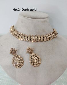 * Light weight Silver necklace Set with earrings Tikka as shown in the     pic.  * Studded with crystals and rhinestones.  * One of a Kind. *Adjustable at any neck. *No.1 to No.4 *Necklace width- 0.6 inches *Earrings length- 1.7 inches Bollywood Style Silver Necklace With Matching Earrings, Heavy Round Kundan Necklace For Party, Traditional Rose Gold Bridal Necklace For Formal Occasions, Round Metal Kundan Necklace For Party, Kundan Round Necklace For Parties, Round Kundan Metal Necklace For Party, Hand-set Round Kundan Necklace For Parties, Hand Set Round Kundan Necklace For Party, Gold Kundan Necklace With Elegant Design For Party