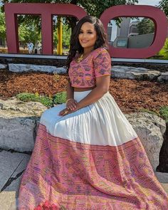 This stylish and modern Habesha dress features a beautiful pink pattern, complete with a chic crop top and skirt combination. Perfectly blending traditional Ethiopian design with contemporary fashion, this Habesha Kemis is ideal for making a bold statement at any event. Material Cotton Menen Thread Estimated delivery : 4 week to 6 weeks Contact WhatsApp +1(304)-306-2784Email: contact@ethiopian.store Habesha Kemis Modern, Dress Crop Top, Eritrean Dress, Habesha Dress, Ethiopian Traditional Dress, Ethiopian Dress, Habesha Kemis, Crop Top And Skirt, Crop Top Dress