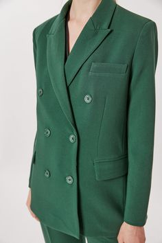 This Deluc Sophia Blazer is a stylish and sophisticated addition to your wardrobe. The double breasted blazer is crafted from a polyester-rayon blend in a bold pine green hue and features an oversized fit. The model is wearing an XS. Green Double-breasted Pea Coat With Button Closure, Elegant Green Blazer Dress For Fall, Classic Green Double-breasted Pea Coat, Spring Business Green Outerwear, Chic Green Blazer Dress For Office, Green Blazer Dress For Office, Green Blazer With Button Closure And Suit Collar, Green Double-breasted Pea Coat With Buttons, Green Single Breasted Pea Coat For Work