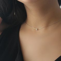 "A stunning yet simple necklace made of 925 sterling silver chain set with a sterling silver bead pendant. Wear this piece as a single necklace for your everyday look or layer it with other gold necklaces for a statement elegant look. Feel free to contact me for details & options. Available also in gold: ♥https://www.etsy.com/il-en/listing/628526854/minimal-14k-gold-filled-stardust-bead You can attach it with another layered necklace: ♥https://www.etsy.com/il-en/listing/642368515/sterling-si Minimal Choker, Diamond Infinity Necklace, Single Necklace, Bamboo Hoop Earrings, Dot Necklace, Sea Glass Bracelet, Bead Choker, Necklace Clasps, Silver Jewelry Necklace