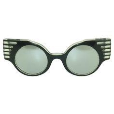 From the 'High Priestess of Paris' via 1980's Los Angeles, a fabulous pair of black sunglasses by designer, Michele Lamy. These frames boast a unique silhouette with an angular style earning the moniker 'Cadillac Tailfin' sunglasses. They have mirrored lenses which add a touch of space age style to an otherwise retro punk look. Unique and artistic ... just like the designer herself! ABOUT THE DESIGNER Michelle Lamy began her design career in 1980's Los Angeles. She has a unique style that combin Michelle Lamy, Michele Lamy, Black Cadillac, Streetwear Goth, Punk Looks, Accessory Ideas, High Priestess, Look Retro, Retro Punk