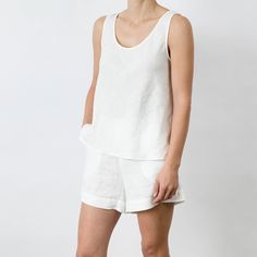 Light and breathable, this singlet is comfortable enough to sleep in or can simply be slipped on to allow you to go about your day. We recommend pairing with the Piper Linen Short. Comfortable Tank Top For Loungewear, Tank Camisole For Relaxation, Summer Loungewear Tops With Wide Straps, Wide-strap Tops For Summer Loungewear, Wide Strap Tops For Summer Loungewear, Sleeveless Camisole For Summer Relaxation, Summer Sleeveless Camisole For Relaxation, Casual Cami Tank Top For Relaxation, Casual Cami Tank Top