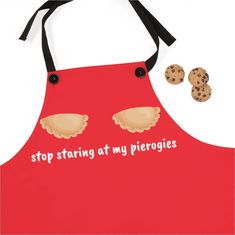 a red apron with cookies on it and the words stop staring at my pies