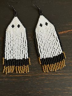 Ghost Brick Stitch Earrings Using Toho Glass 11/0 Seed Beads Colors - White, Black & Gold Length Of Earring (Not Including Earring Hook) - 3.50 Inches Width Of Widest Part - 1.25 Inch A Fun Statement Earring That Is Sure To Be Noticed! Beaded Dangle Earrings For Halloween, Dangle Beaded Earrings For Halloween, Beaded Earrings For Halloween Party, Adjustable Beaded Earrings For Halloween, Halloween Party Beaded Earrings, Halloween Beaded Dangle Earrings Gift, Halloween Gift Beaded Dangle Earrings, Seed Bead Fringe Earrings, Bead Fringe Earrings