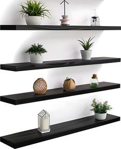 three black shelves with plants on them