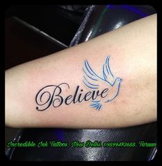 a tattoo with the word believe on it and a bird flying above it, in black ink